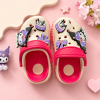 ute Kuromi-inspired kids' clogs with decorative charms, pink adjustable strap, breathable design, and lightweight EVA sole on a pastel pink background.